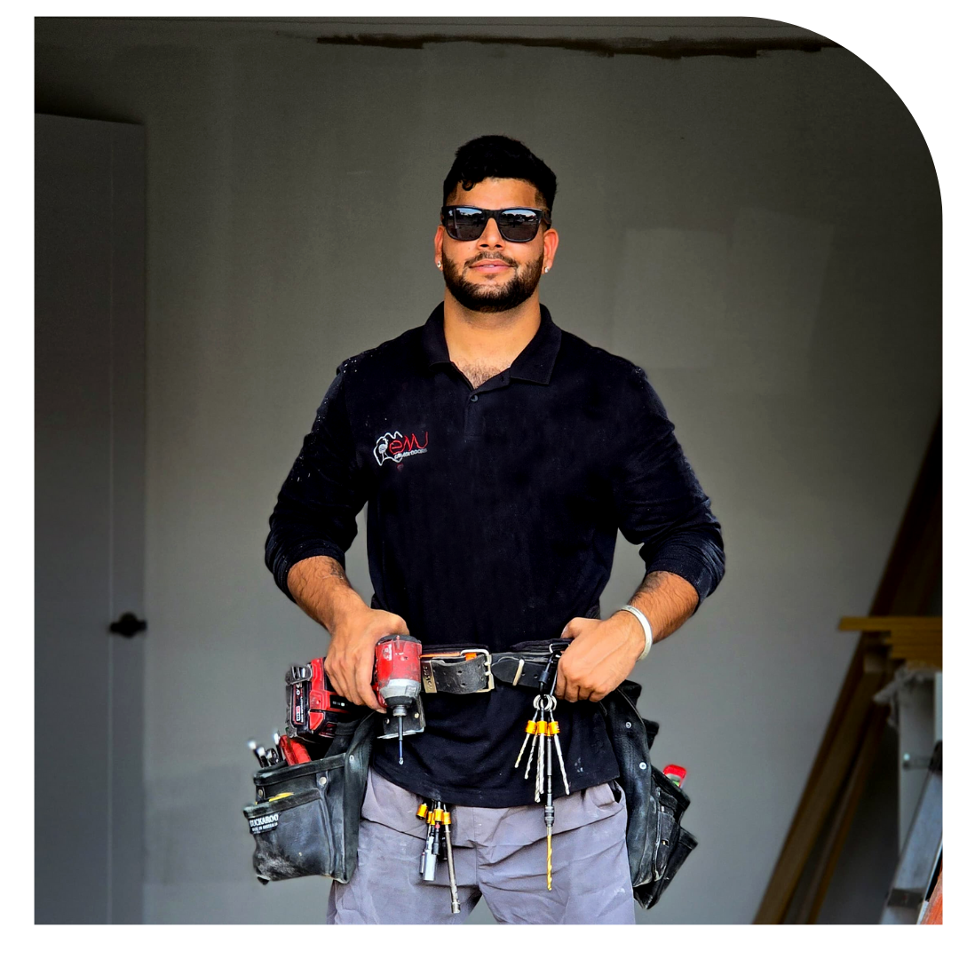 Modern Mechanic fixing garage door.