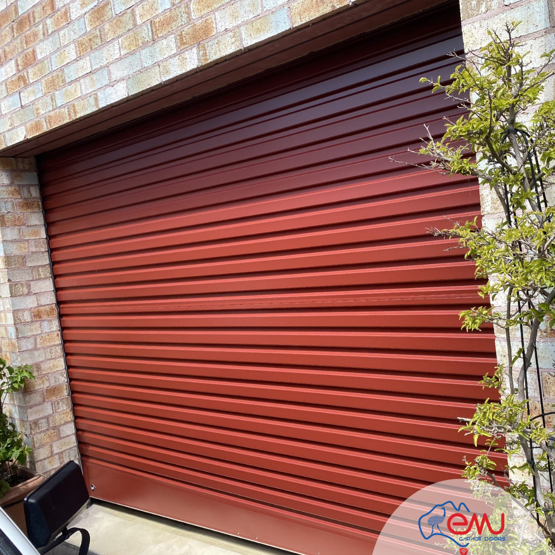 Outdoor view of a roller garage door being repaired