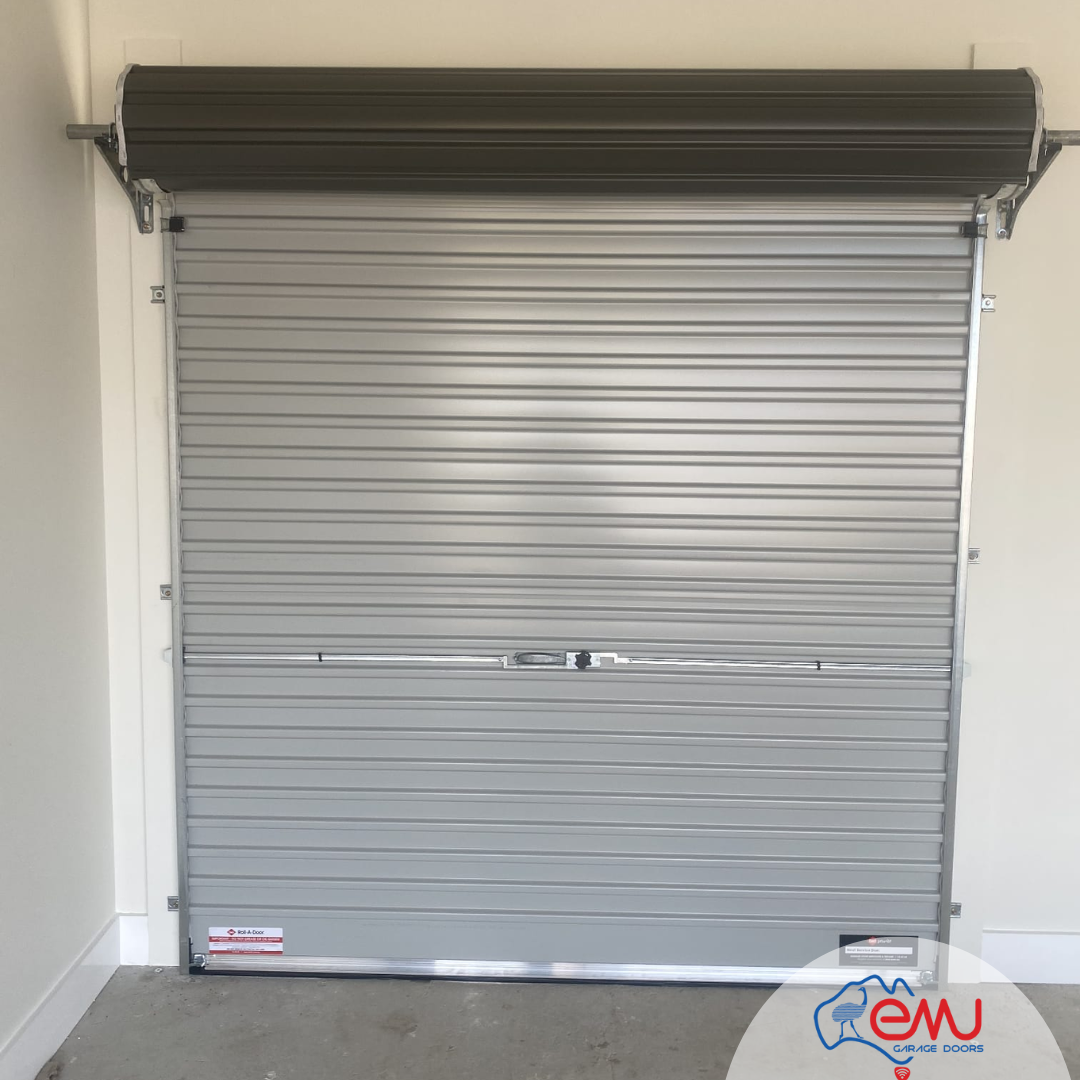 Modern roller garage door with a light gray finish.